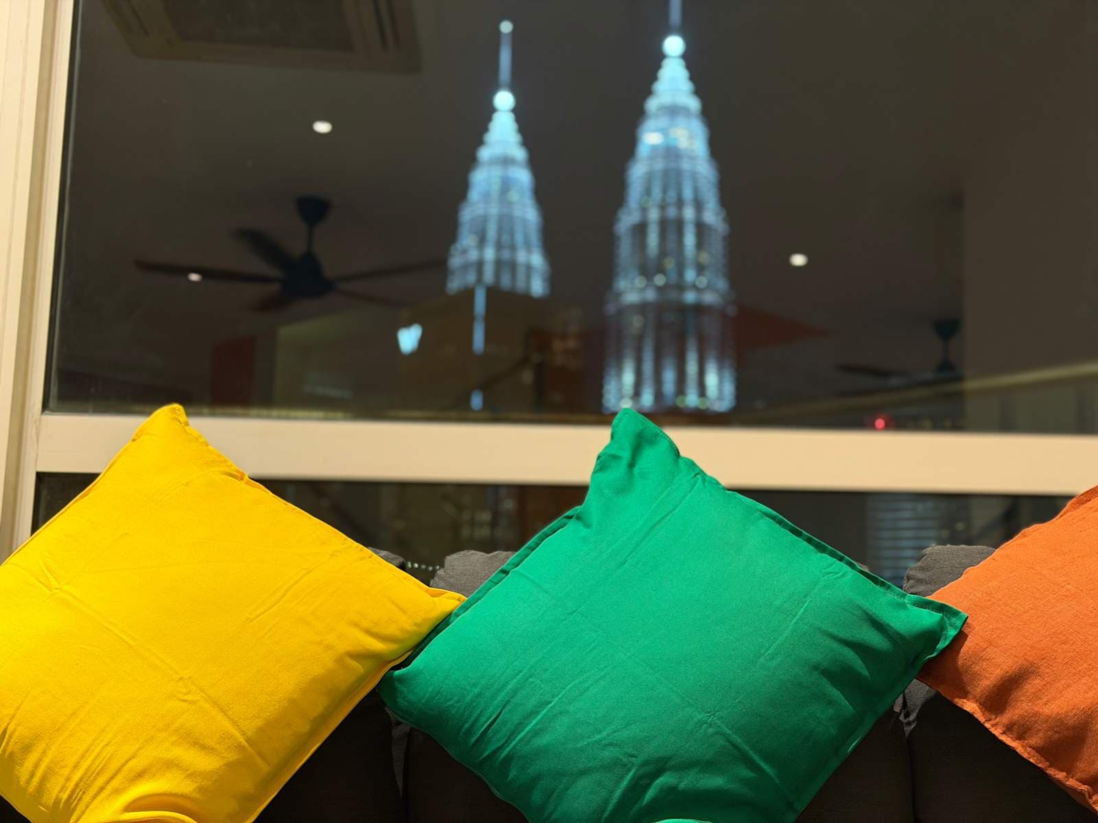 Colorful cushions and KL skyline from the lounge