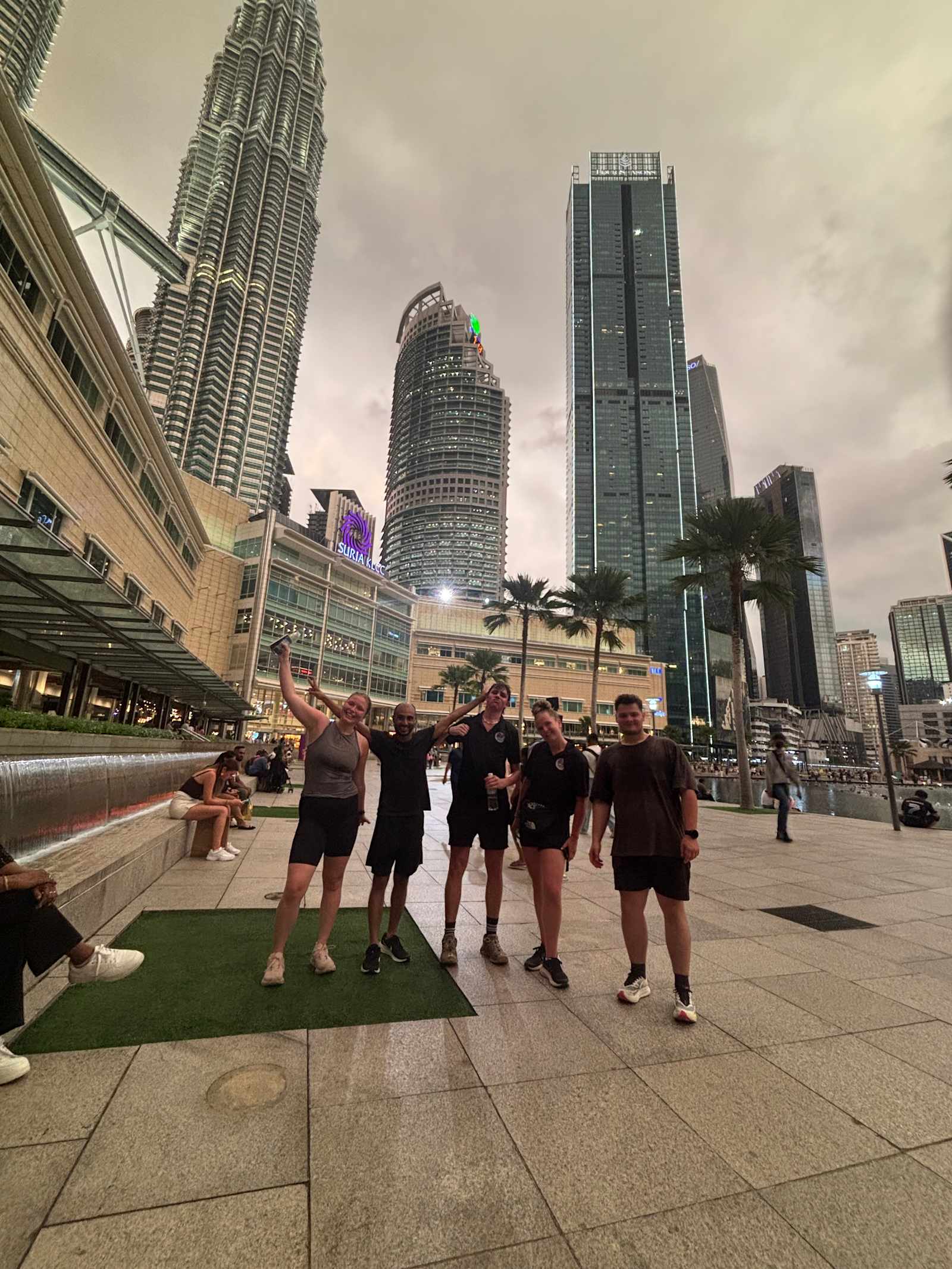 Travelers at KLCC by the Petronas Twin Towers